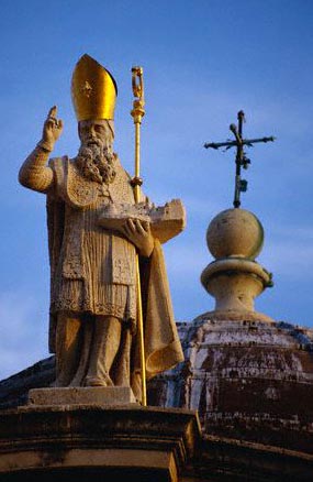 A statue of St. Blaise atop a Cathedral